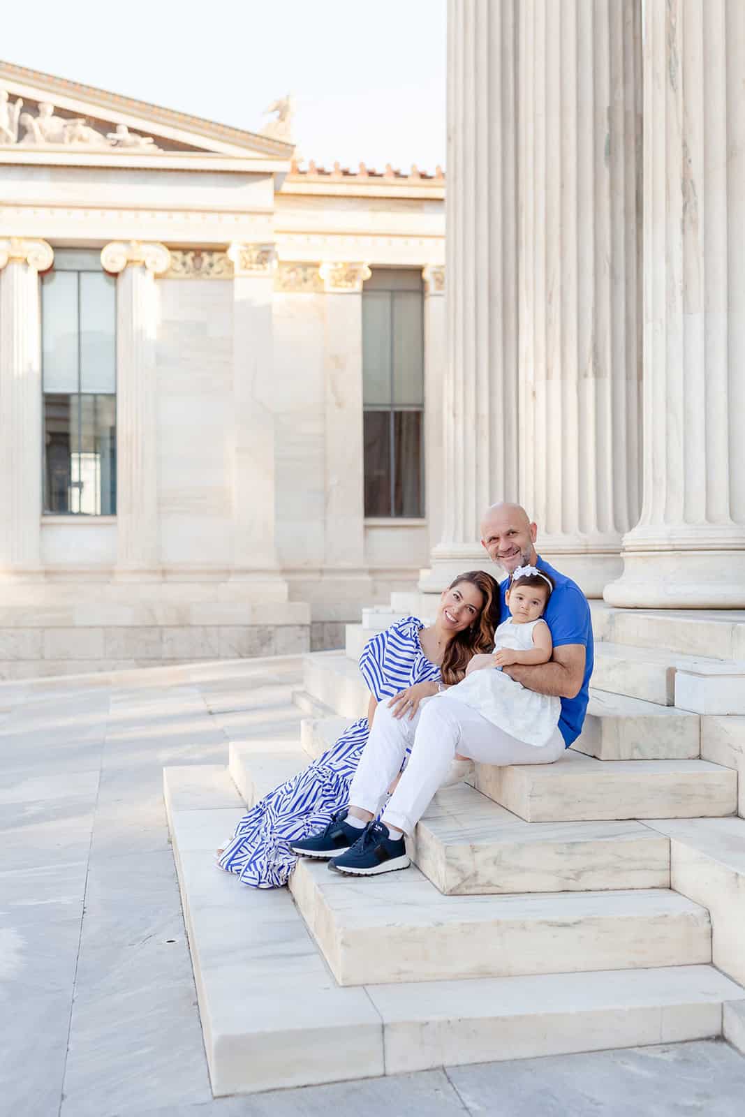 Luxury family portraits in Athens Greece in front of Greek columns by Family photographer Anette Cook